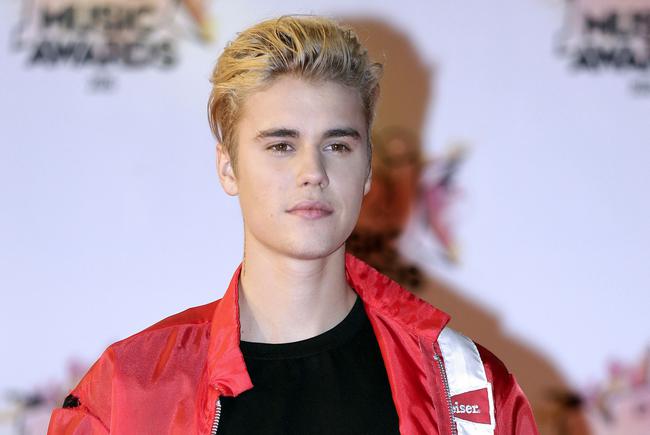 FILE - In this Nov. 7, 2015 file photo, Justin Bieber arrives at the Cannes festival palace in Cannes, southeastern France. Justin Bieber could add another five MTV EMA European music awards to the five he won last year. Bieber is tied with Beyonce for the most nominations at the awards show Sunday, Nov. 6, 2018, in the Dutch port city of Rotterdam. (AP Photo/Lionel Cironneau, File)