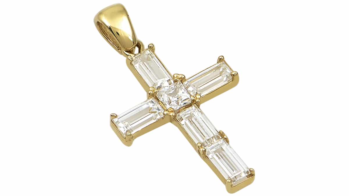 Σταυρός από κίτρινο χρυσό Κ14 με μπαγκέτες λευκά ζιρκόν, €300, Πανίδης, www.panidis.gr