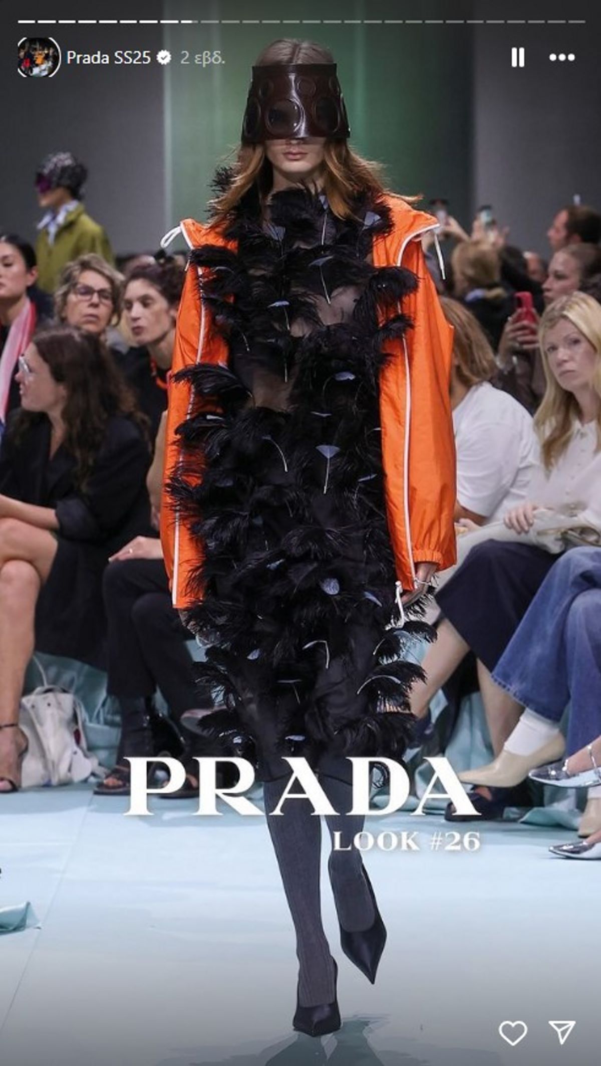 show prada S/S 2025 παρκά πορτοκαλί και φόρεμα με φτερά
