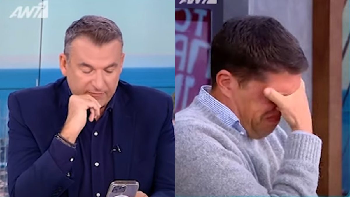 Ο Λιάγκας με σκυμμένο κεφάλι και ο Παπανδρέου κρύβει το πρόσωπό του για να μην φανεί το κλάμα του